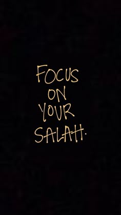 the words focus on your salah written in yellow chalk against a black background with an orange outline