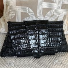 Grab This Chic Croc Clutch From Juliette Jake For Some Sleek And Stylish Vibes! Made With A Classic Silhouette, This Tantalizing Textured Treasure Is A Wrap Around Design, Perfect For Adding A Bit Of Sophistication & Fun To Any Outfit, Day Or Night. Genuine Crocodile Wrap Around Design Snap Button Closure Leather Interior Zippered Interior Pocket Width 12.5" Height 6" Stunning Clutch And A Collection Item In A Perfect Condition Crocodile Leather, Classic Silhouette, Leather Interior, Wrap Around, Snap Button, Clutch Bag, Bag Lady, Sleek, Leather