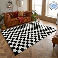 a black and white checkered area rug in a living room with leather couches