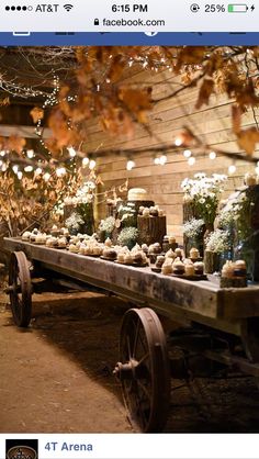 an old wagon with flowers and candles on it