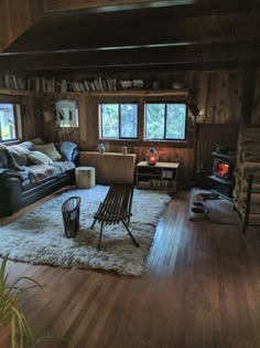 a living room filled with furniture and a fire place next to a wooden burning stove