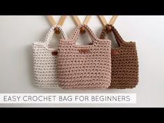 three crochet bags hanging on a wall with the words easy crochet bag for beginners