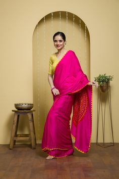 Effortless and Luxurious  A plain pink saree with detailed edge of yellow colour (called Kangoora) all over and a beautiful anchal of Bandhani (called Raasmandal)  Raasmandal is a form of sportive dance move in the circular motion where lord Krishna and the cowherdness of vrindavan enjoy dancing... our amazing artisians have bought this art in the form of living peice on this saree... Art Lovers  this blouse is just for styling purpose, this saree comes with the red colour bandhani blouse (unsti Pink Raw Silk Pre-draped Saree With Dupatta, Traditional Pink Slub Silk Salwar Kameez, Navratri Slub Silk Traditional Wear With Embroidered Border, Pink Slub Silk Saree Set, Traditional Pink Pre-draped Saree With Embroidered Border, Slub Silk Pre-draped Saree With Cutdana For Navratri, Dola Silk Pre-draped Saree With Embroidered Border For Puja, Slub Silk Traditional Wear With Embroidered Border, Traditional Wear With Embroidered Border In Slub Silk