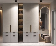 a large white closet with mirrored doors and drawers