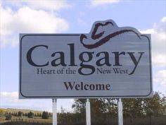 a large sign for the heart of the new west welcomes visitors to calgary