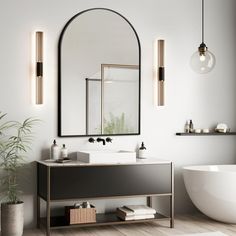 a bathroom with a sink, mirror and bathtub next to a potted plant