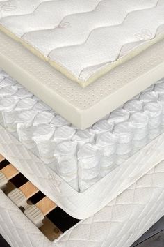 three mattresses stacked on top of each other