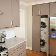 a kitchen with stainless steel appliances and cabinets