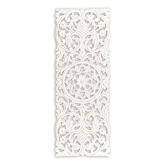 an intricate white paper cutout on a white background