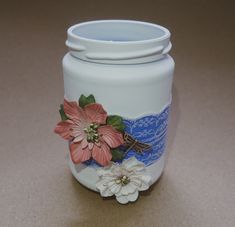 a white vase with flowers painted on it