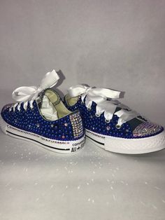 Custom Bling Converse All Star Chuck Taylor Sneakers. All designs handmade and embellished with a variety of high quality crystals. Great for weddings, proms, homecomings, birthdays, special events or just your everyday girly girl. Turn around time is currently 2 - 3  weeks **IF YOU NEED THIS ITEM BEFORE THE PROJECTED SHIPPING TIME YOU MUST CONTACT US BEFORE ORDERING (additional charges may apply) **Shoe Size: Sizes stating at women's size 6 to women's size 12;  Size availability may vary based Dallas Cowboys Bling Converse, Blue Rhinestone Shoes, Wedding Crocs, Denim And Diamonds Party, Bedazzled Converse, Bling Clothes, Rhinestone Converse, Frozen Shoes, Quinceanera Shoes