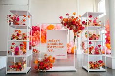 there are many shelves with flowers and balloons on them