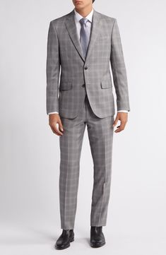 Grey Italian wool woven in a chalky plaid distinguishes a suit that's styled with traditional detailing to make it a smart addition to any formal wardrobe. Jacket has notched lapels; four-button cuffs; chest pocket; flap pockets; side vents Trousers have zip fly with button-tab closure; slant pockets; back button-welt pockets Jacket is lined Unhemmed 100% wool Dry clean Made in Canada Tailored Plaid Suits For Business, Tailored Plaid Suit For Semi-formal Occasions, Plaid Suits For Semi-formal Occasions, Plaid Suiting Fabric Suit For Workwear, Plaid Suiting Fabric Suits For Workwear, Semi-formal Plaid Suit, Plaid Semi-formal Suit, Tailored Plaid Suits With Welt Pockets, Tailored Plaid Suit With Notch Lapel