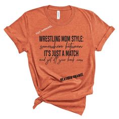 an orange t - shirt with the words wrestling mom style and it's just a match