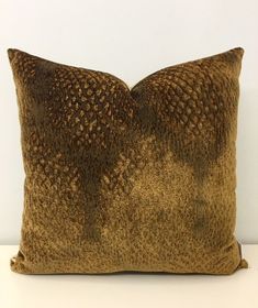 a brown pillow sitting on top of a white table