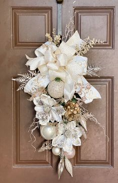 a door decorated with white flowers and ornaments