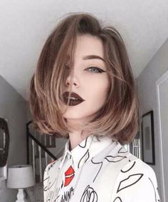 a mannequin with lipstick painted on it's lips in front of a mirror