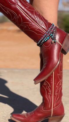 Lobster claw closure Boot and feather turquoise accents at closure Silver-toned hardware Turquoise, red, and brown beads with iridescent beaded accents 3-in-1 necklace, bracelet, and boot accessory Imported Beaded Boots, Cowgirl Photoshoot, Yee Yee, Boot Bracelet, Turquoise Accents, Red And Brown, Fragrance Gift, Fragrance Gift Set, Boot Accessories