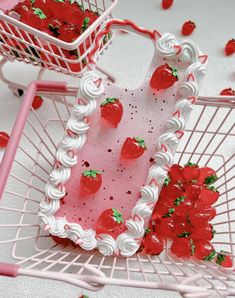 two baskets filled with strawberry shortcakes on top of a white table next to each other