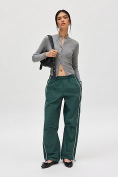 Effortless track pants from BDG. Our BDG Jess nylon track pants have an easy fit with a low rise and a relaxed straight leg. Essential track pants styling with contrasting piping at the sides. Find these staple track pants only at Urban Outfitters. Features BDG Jess nylon track pants Wide leg track pant Mid rise elasticated waistband Side pockets Piping down the legs Relaxed, straight-leg fit Full length Pull-on style UO exclusive Content + Care 100% Nylon Machine wash Imported Size + Fit Model Harem Pants Street Style, Straight Leg Track Pants, Green Adidas Track Pants, How To Style Track Pants, Nylon Track Pants, Women Joggers, Track Pants Outfit, Style Goals, Adidas Track Pants