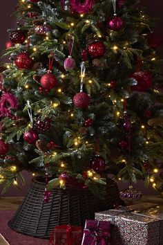 a decorated christmas tree with presents under it