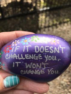 someone is holding an easter egg with writing on it that says if it doesn't challenge you, i won't change you