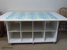 a white table with blue and yellow designs on it