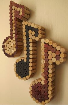 a wooden sign made out of wine corks with the letter f on it's side