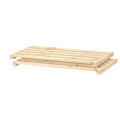 two wooden pallets sitting side by side on a white background and one is empty