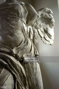 an angel statue is shown in this black and white photo