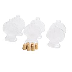 three glass shell shaped bottles with corks