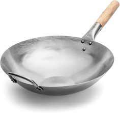 an empty frying pan with a wooden handle on a white background for use in cooking