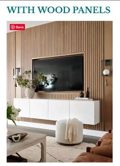 a living room with wood panels on the wall