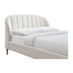 the bed is made up with white linens and pillows on it's headboard