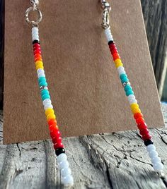 Simple, beautiful Native American made single strand earrings. Size 11 beads. Native American Earrings Diy, Southwestern Style Earrings With Dangling Round Beads, Adjustable Multicolor Earrings With Spacer Beads, White Beads With Ear Wire For Jewelry Making, Southwestern Tiny Beads Dangle Earrings, Southwestern Dangle Earrings With Tiny Beads, Southwestern Style Dangle Earrings With Tiny Beads, White Round Bead Southwestern Earrings, Adjustable White Beaded Earrings With Spacer Beads