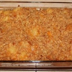 a casserole dish filled with food sitting on top of a stove