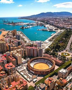 an aerial view of the city and water