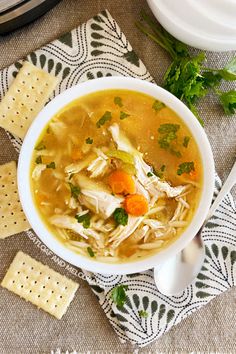 instant pot rotissee chicken soup in a bowl with crackers