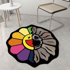 a room with a chair and a rug on the floor that looks like a flower