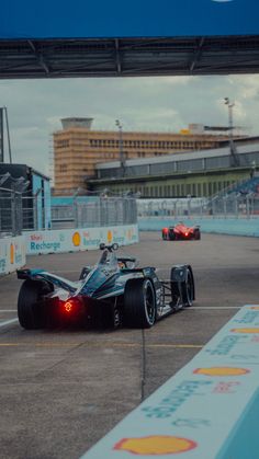 a race car is driving down the track