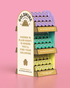 a display case for gummy bears on a pink background with the caption golimine