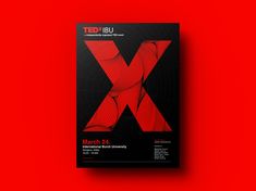 a red and black book with the letter x on it's front cover against a red background