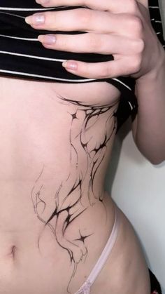 a woman's stomach with black and white lines on it, showing her lower body