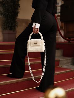 Pearl beaded bags are luxurious and sophisticated accessories that are suitable for formal occasions, such as weddings, proms, and black-tie events.  However, they can also add a touch of glamour and femininity to more casual outfits and can be worn for a night out or a dinner party. The bag is woven from fishing line, which can withstang 25 kg. It is very reliable as it closes with a magnetic clasp.  100% handmade Material: acrylic pearl beads 8 mm  We offer 2 sizes of this handbag: 1 Size:  > Pearl Purse Outfit, Pearl Bags Design, Luxury Formal Bag, Pearl Bag Outfit, Pearls Bag, Pearl Bags, Pearl Handbag, Prom Purse, Purse Outfit