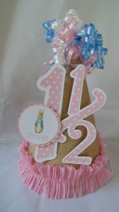 a pink and blue birthday cake with the number 12 on it