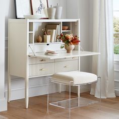 a white desk and chair in a room