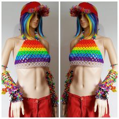 This kandi halter is made with rainbow and clear pony beads. Womens size A-D cup This Item is made to order in your size. Note kandi accessories,visor and pants not included. Perfect for any event! You will get lots of compliments in this unique wearable art! Stand out at your next event! Edm festival Raves Party Rave outfit Festival outfit Pride Mardi gras Rave Festival Stretch Crop Top, Rave Style Stretch Crop Top For Festival, Rave Crop Top For Music Festival, Multicolor Rave Tops For Festival, Rave Style Multicolor Tops For Festivals, Multicolor Rave Festival Tops, Disco Stretch Crop Top For Festival, Disco Style Stretch Crop Top For Festival, Kandi Shirt