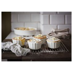 several small pies sitting on top of a cooling rack