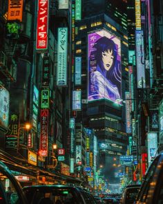 a city filled with lots of tall buildings covered in neon signs