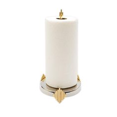 a white toilet paper holder with gold accents